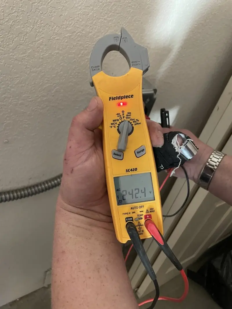 Voltage testing with clamp meter during Generator Installation in Williamson